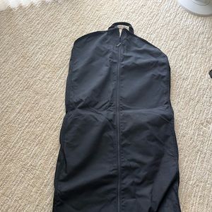 zippered garment bag.  multiple pockets and existing hangar which clamps at top